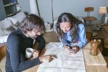 man and woman looking at a map