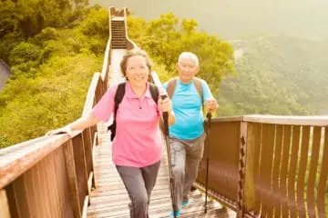 Older couple walking up steps