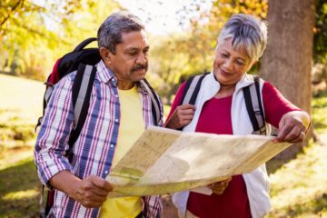 Older hikers looking at a map